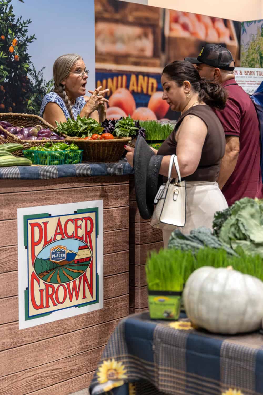 people checking out the Placer Grown booth at Terra Madre Americas