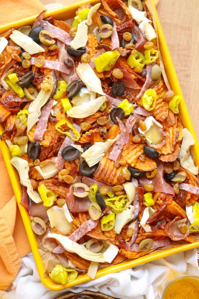 A yellow sheet pan filled with sweet potato charcuterie nachos.