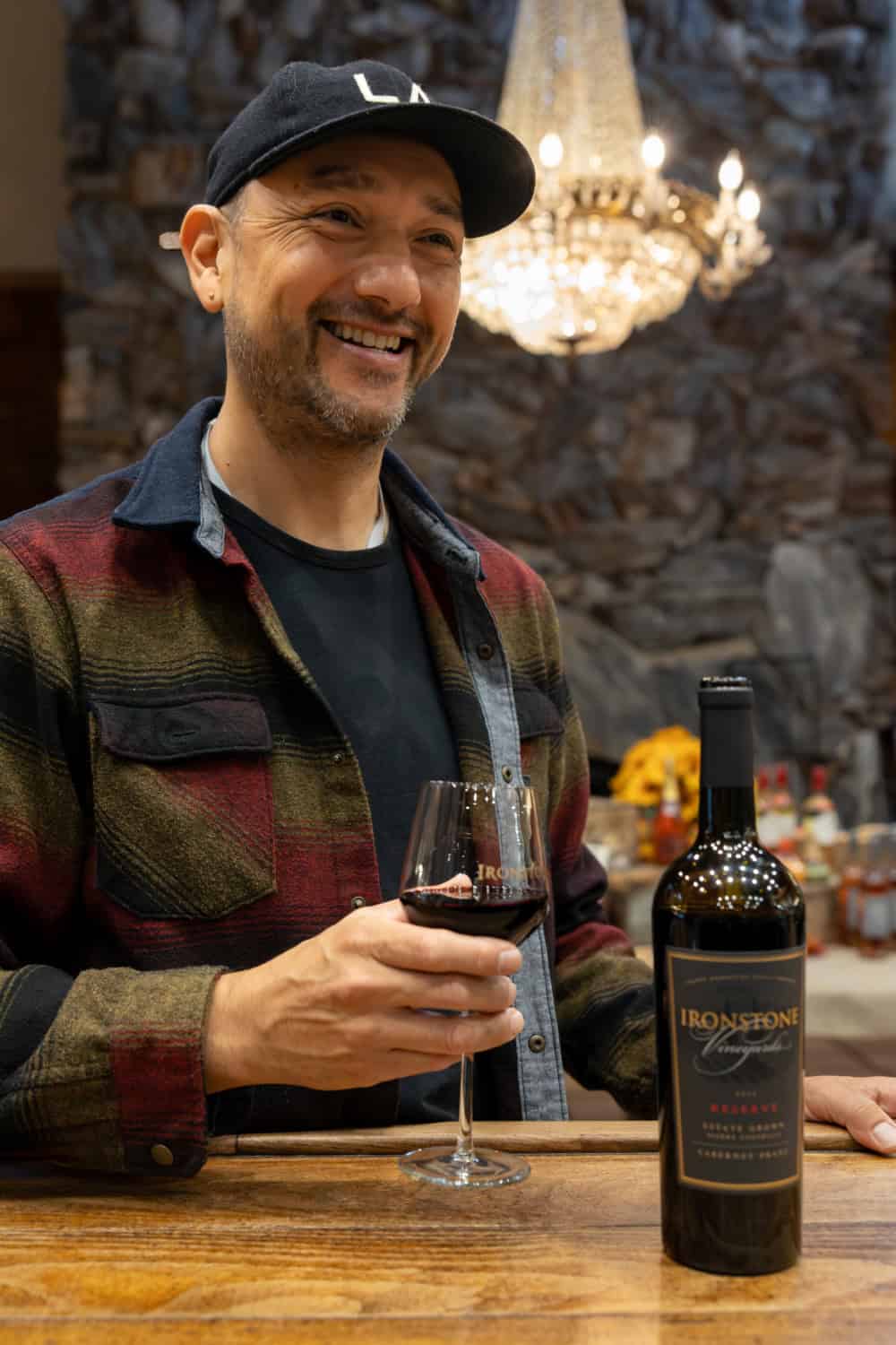 guest enjoying a glass of wine at Ironstone Vineyards