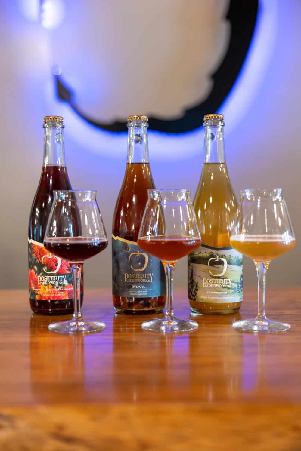 Three of the ciders offered at Posterity Ciderworks poured into glasses to show their range of colors