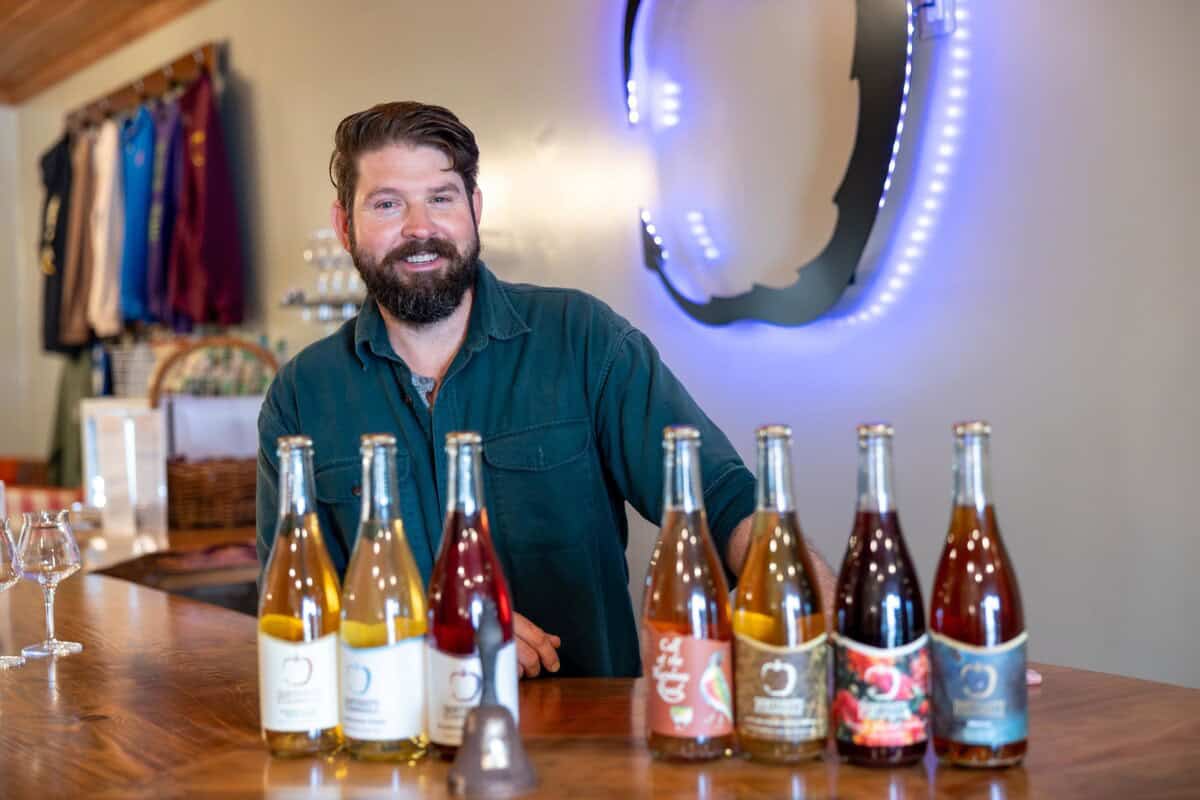 Brendan Barnard behind the bar at Posterity Ciderworks