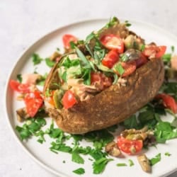 A zoomed in image of a Tuna Niçoise loaded baked potato.