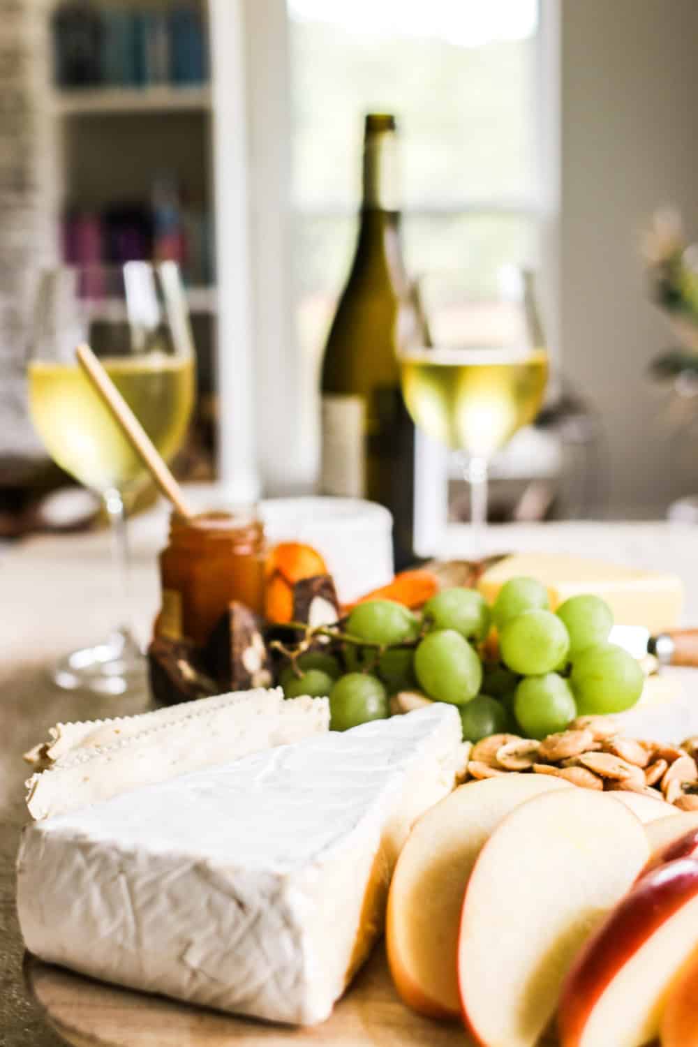 Cheese and wine with grapes and other fresh fruit