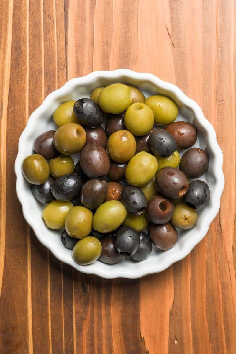 california green and black olives in a white bowl