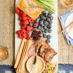 A spring-inspired charcuterie board with whipped honey.
