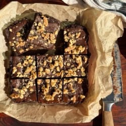 No-Bake Raisin Almond Butter Brownie Bars sliced to serve.