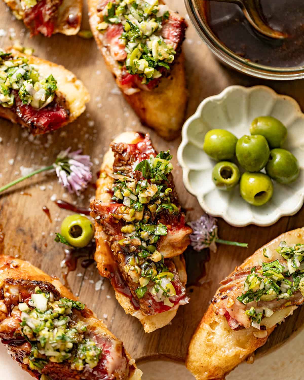 steak crostini topped with olive relish