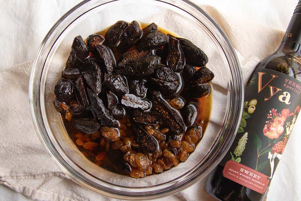 Dried figs and raisins soaking in sweet vermouth.