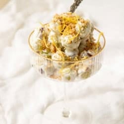 A coup glass filled with old school grape salad.