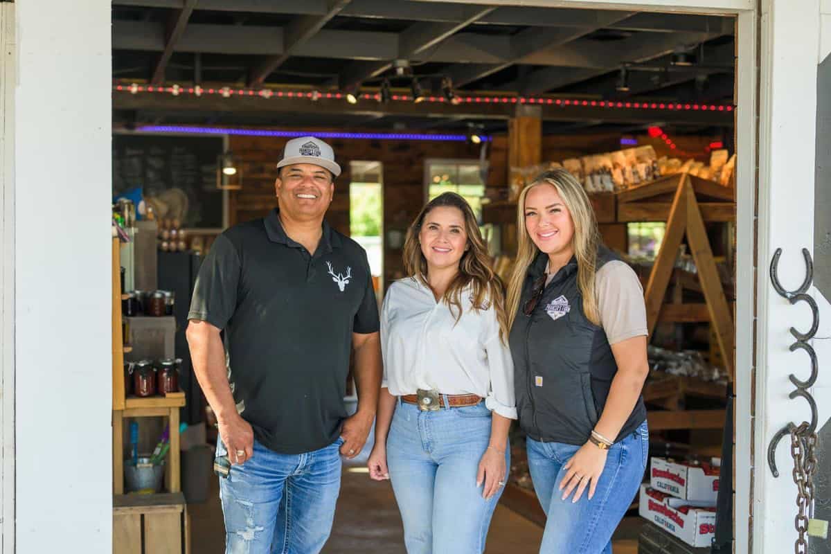 Robledo family standing inside their farm stand