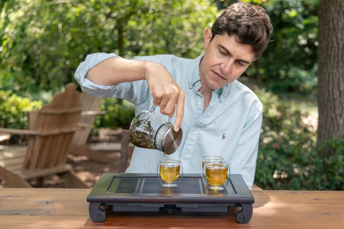 Patrick Sunbury pouring a cup of tea at Redwood Tea Estate