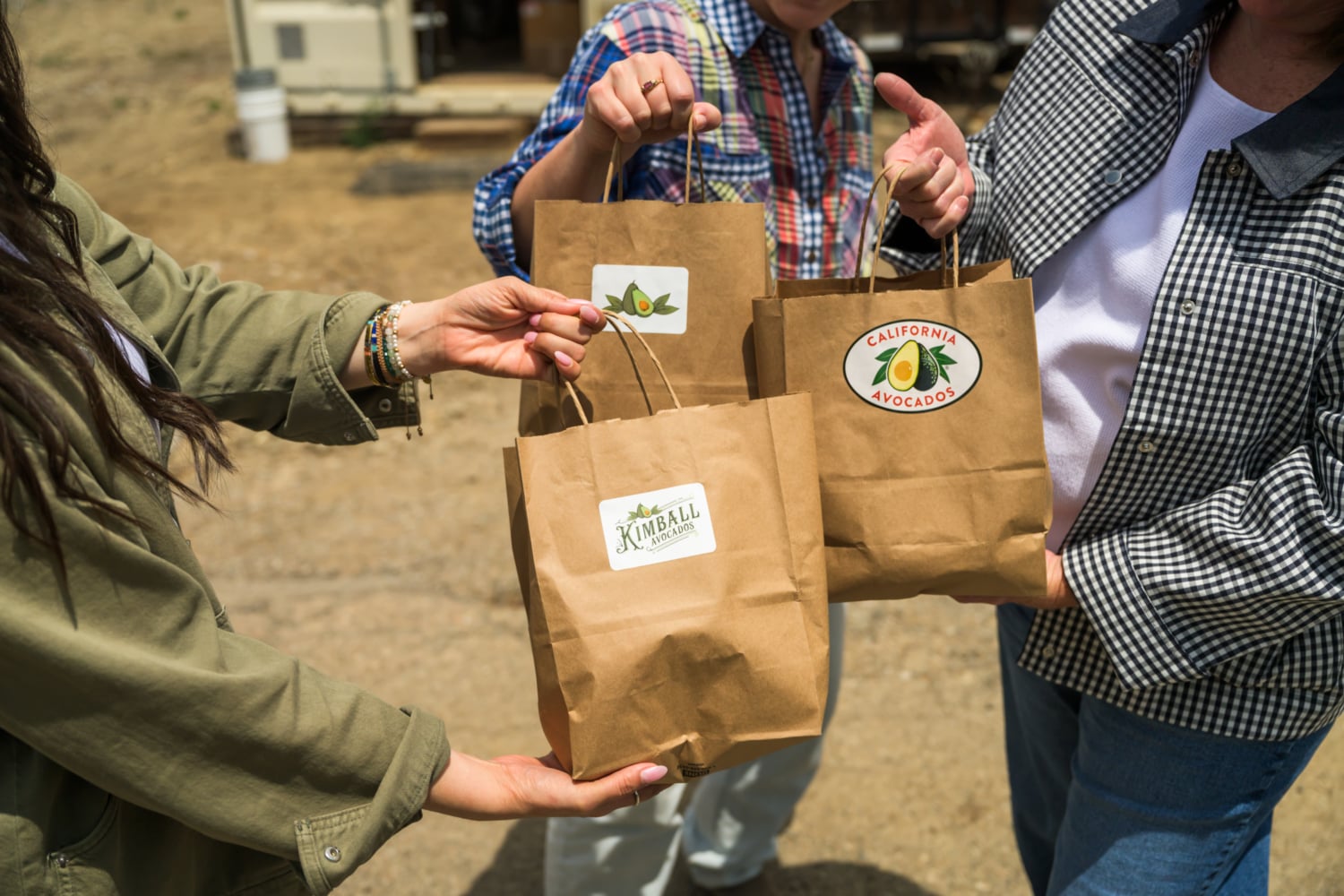 influencers holding bags of Kimball Ranch Avocados