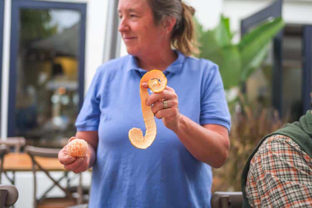 how a farmer peels an Ojai Pixie in one solid piece.
