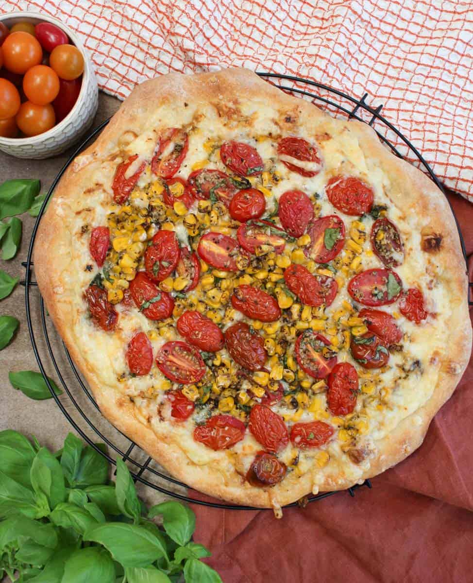 Looking down over top of a summer pizza.