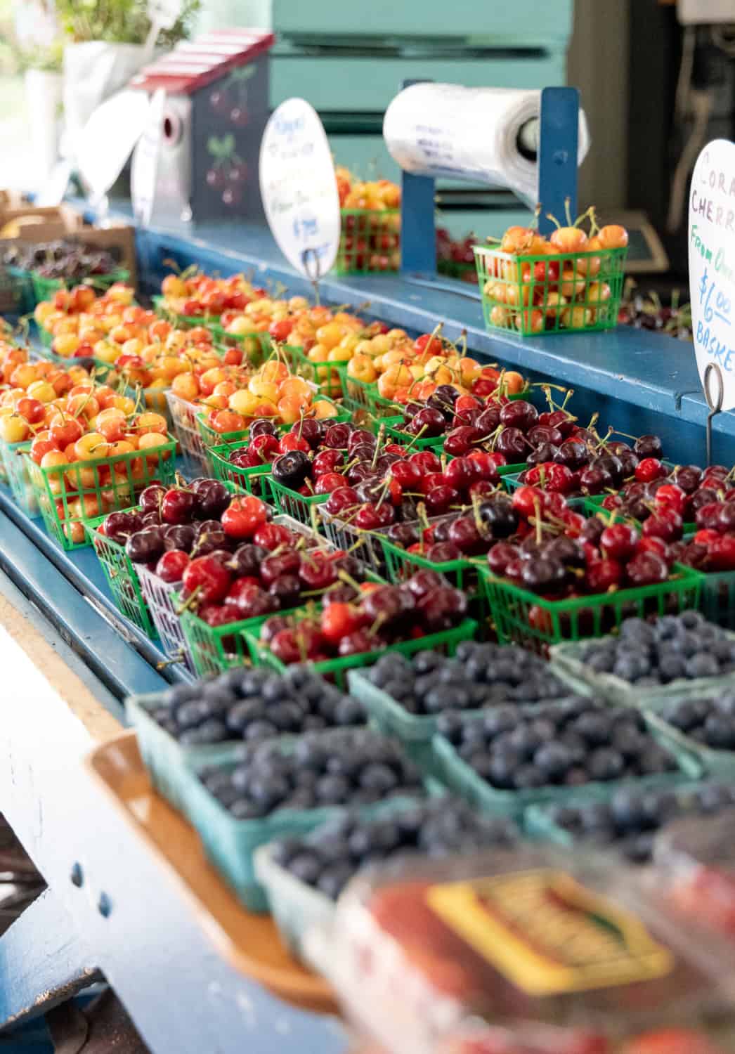 Cherries and blueberries for sale at the fruit bowl