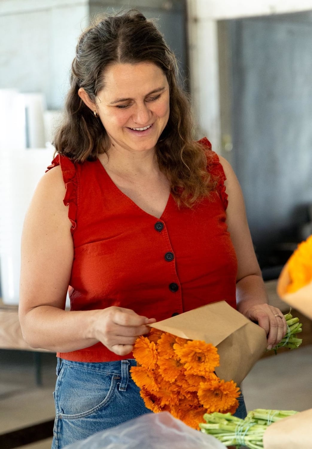 Dru's daughter wrapping fresh flowers at Full Belly Farms