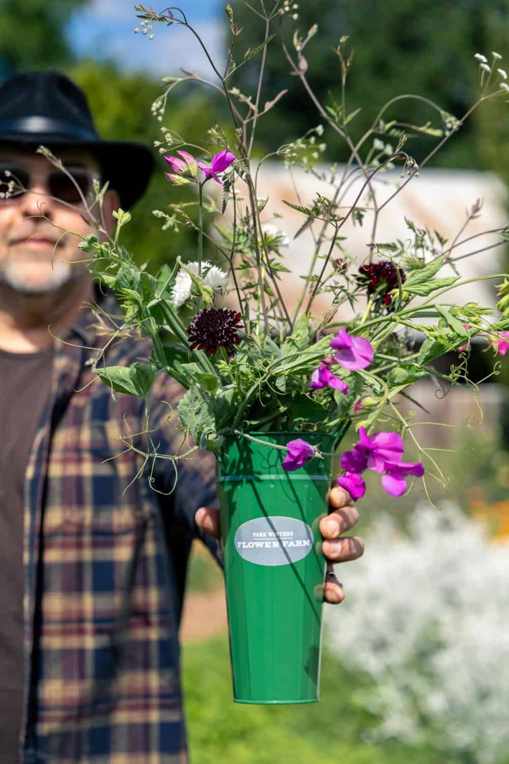 Rafael Galiano holding a bouquet of u-pick flowers