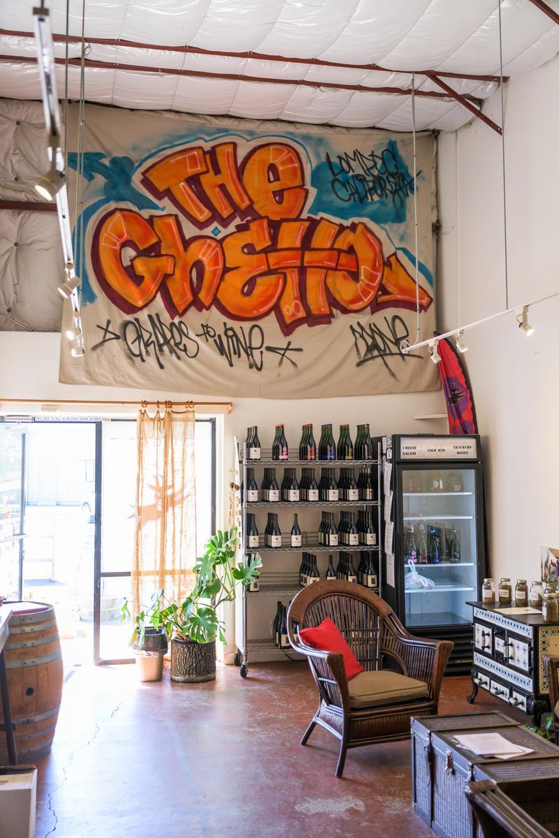 wine ghetto sign hanging from ceiling
