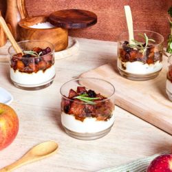 Multiple serving dishes of apple skillet.