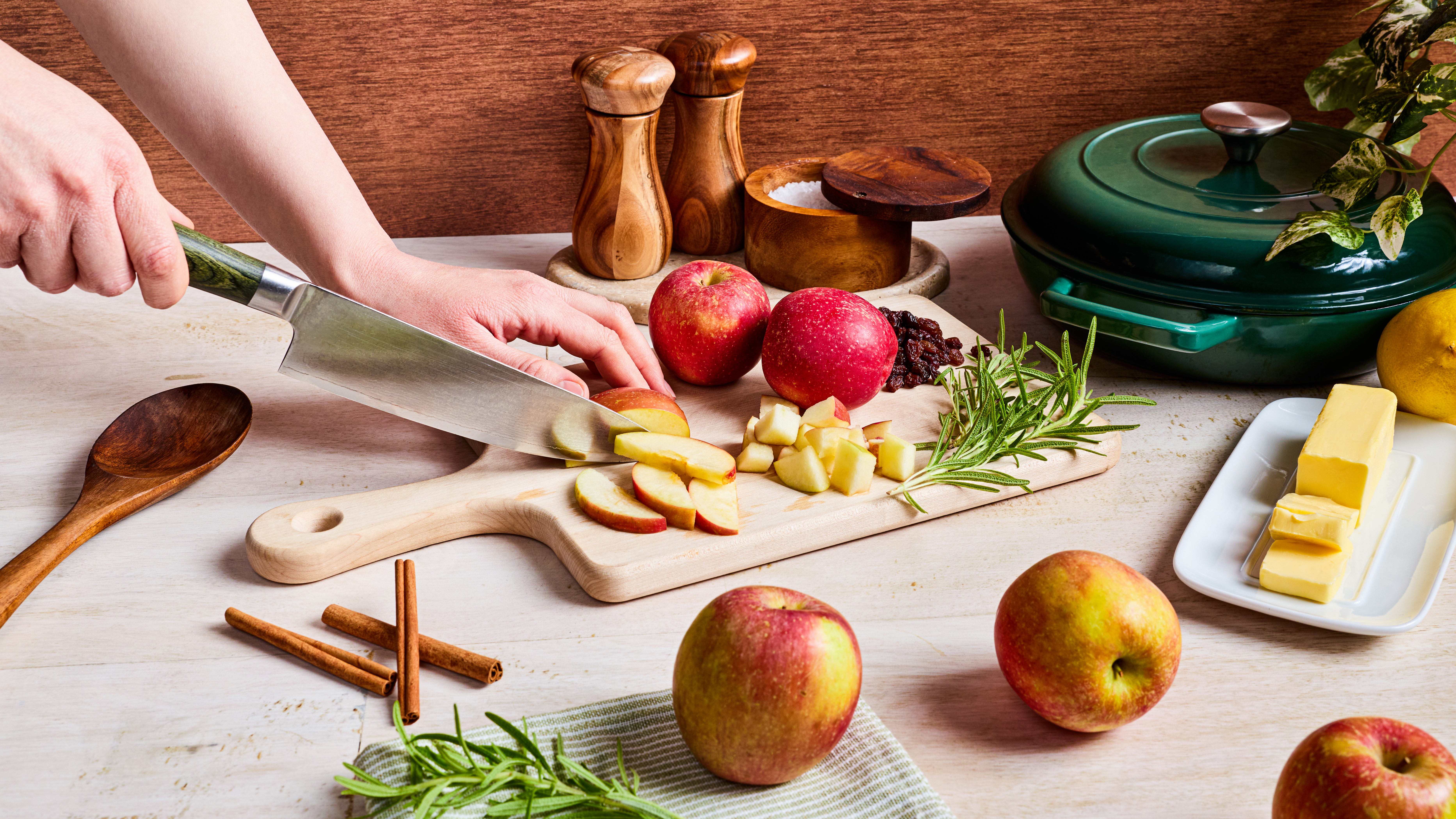 Prepping a sizzling cinnamon appl skillet. 
