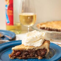 A slice of raisin pie paired with a glass of Quady dessert wine.