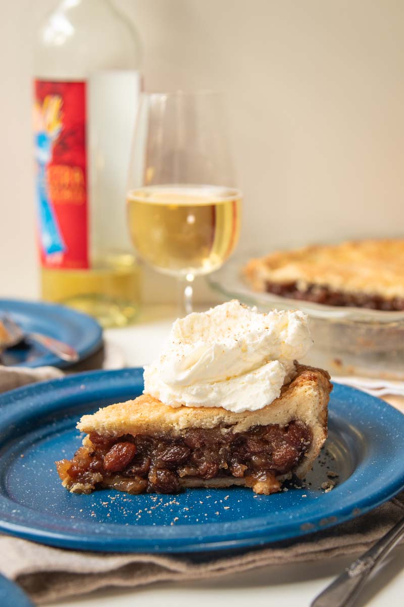 A slice of raisin pie paired with a glass of Quady dessert wine.