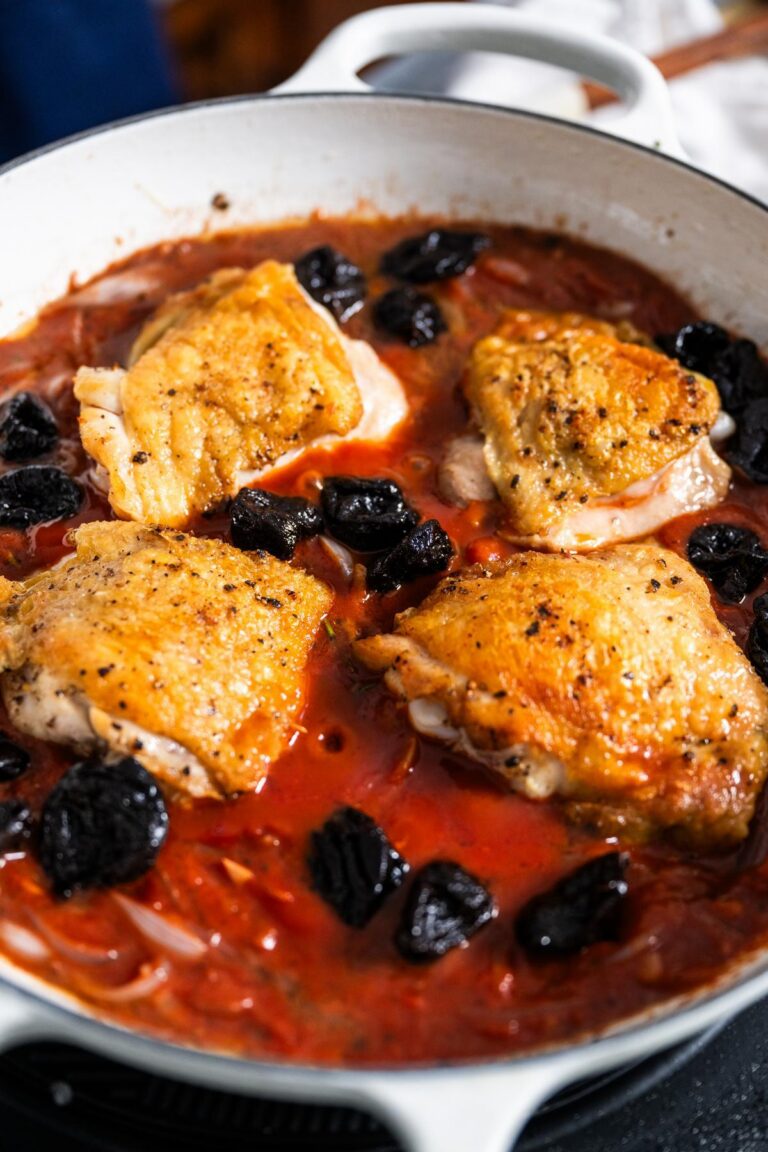 setting chicken into sauce to braise